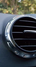Car vents blowing warm air during summer driving