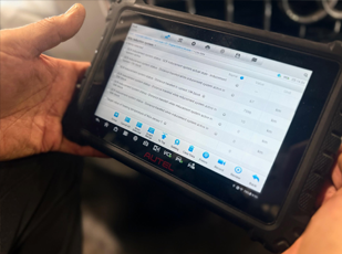 Engine bay inspection paired with scan data review during diagnostics