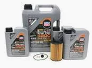 Oil service being performed on a diesel engine