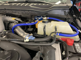 Cooling system service on a truck including coolant inspection